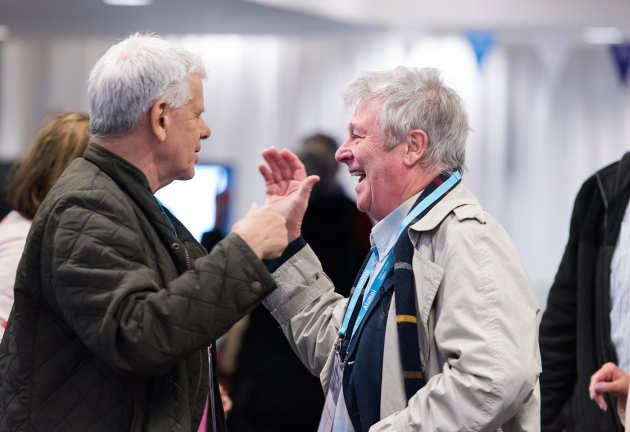 Alumni embrace as they meet at Alumni Weekend