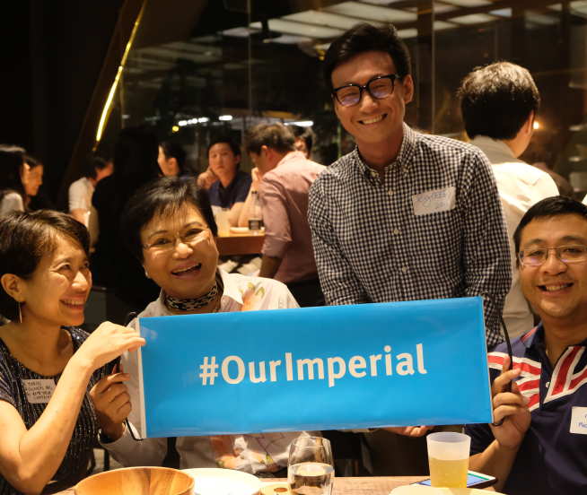 Suvichak (standing) at an event run by the Imperial College Alumni Association of Thailand