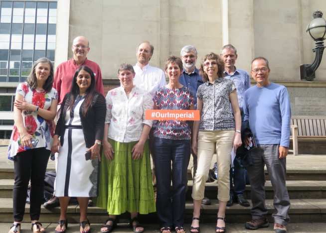 A class of 1984 reunion group on the steps of the Queen's Tower