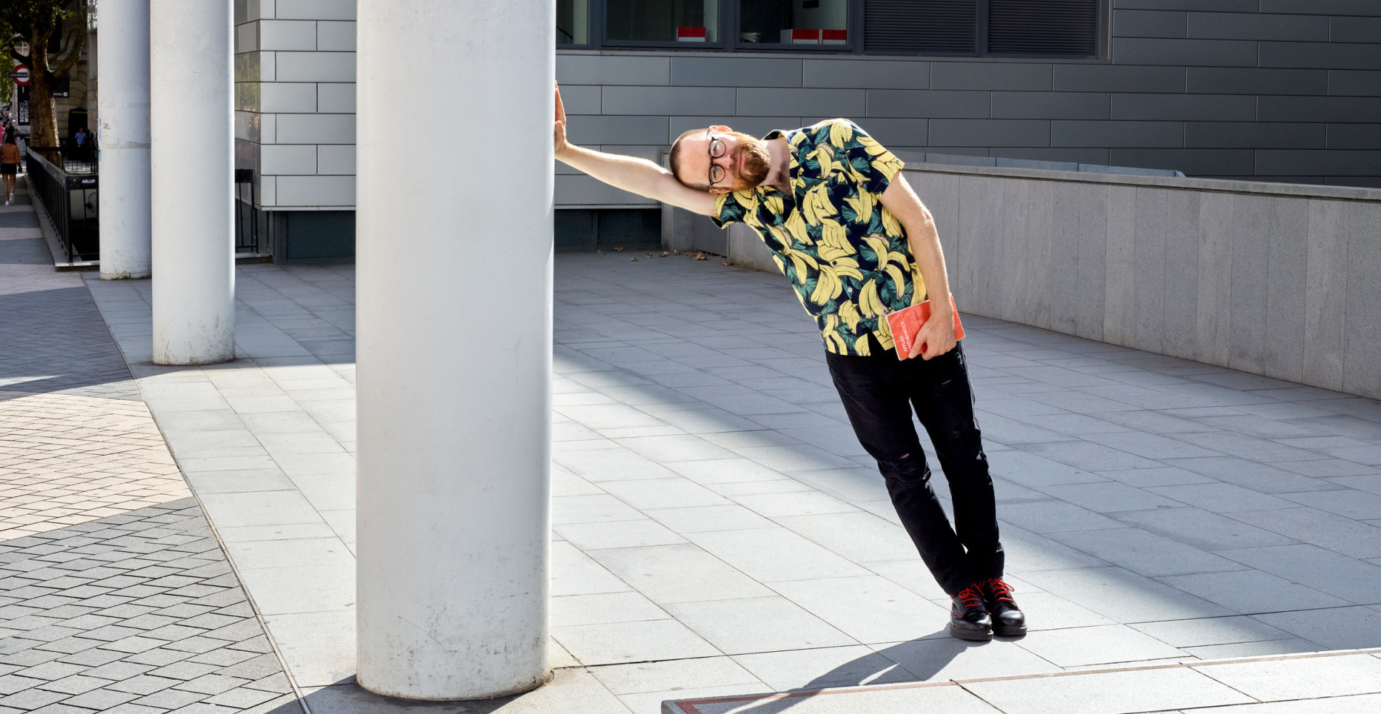 Imperial's Poet in Residence, Dan Simpson, outside the College main entrance on Exhibition Road