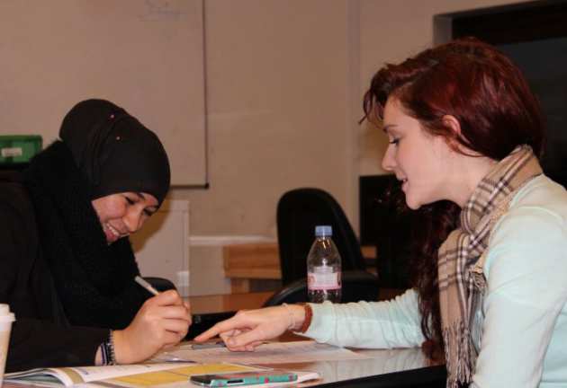 Two females working at a desk