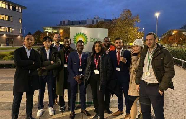 Students sit on chairs in a circle to be mentored during visit to BP Headquarters