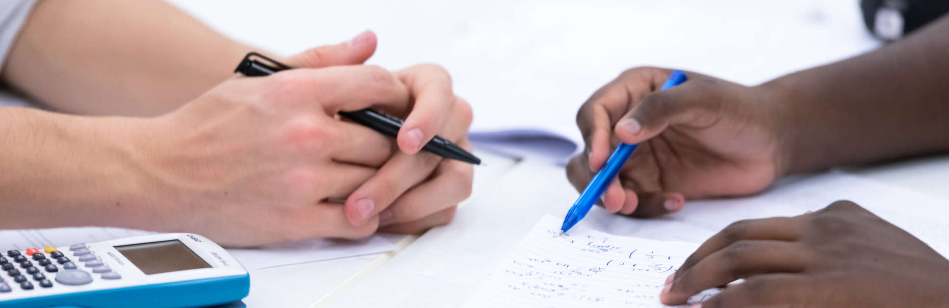 hands and notebooks 