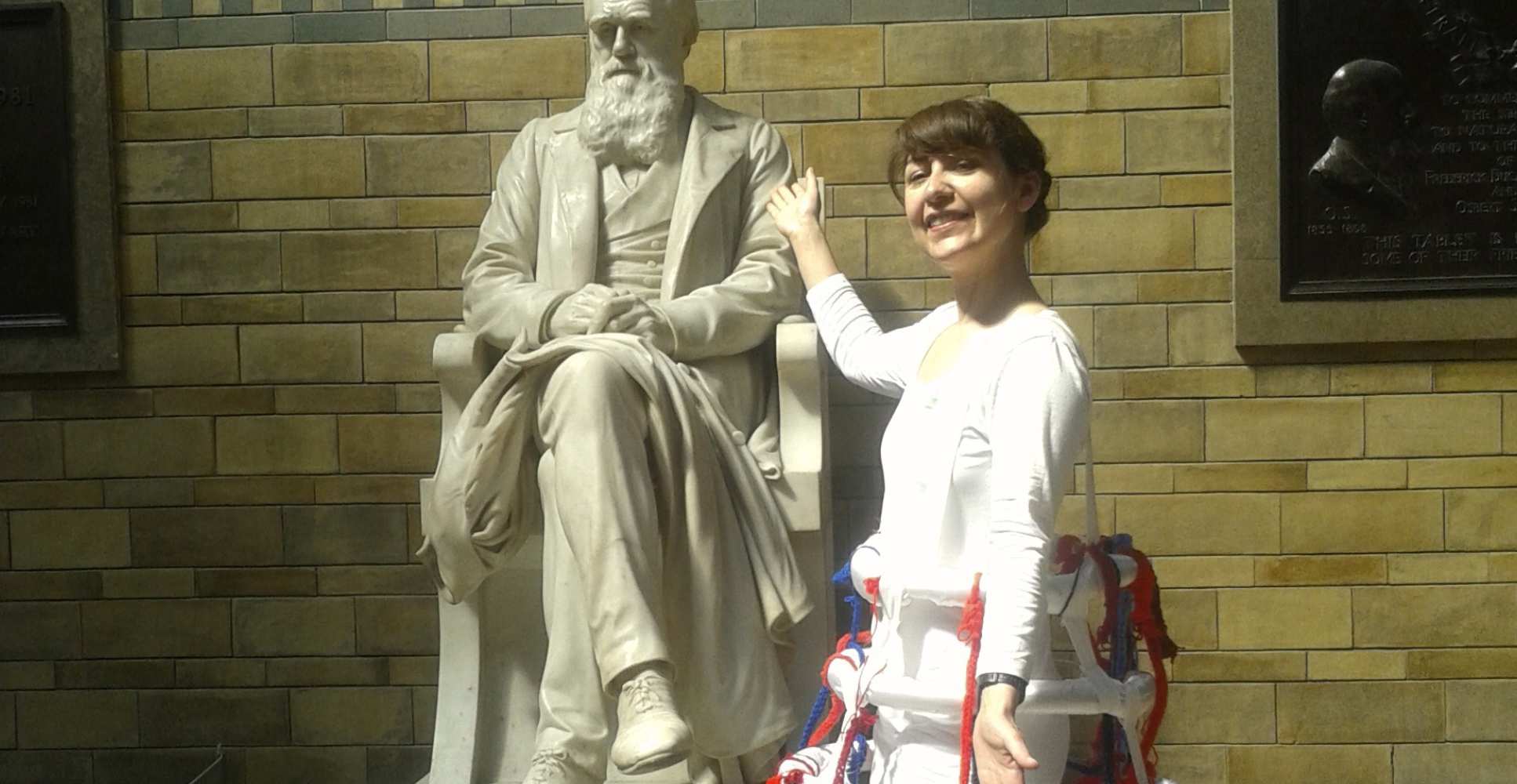 Lady points to statue