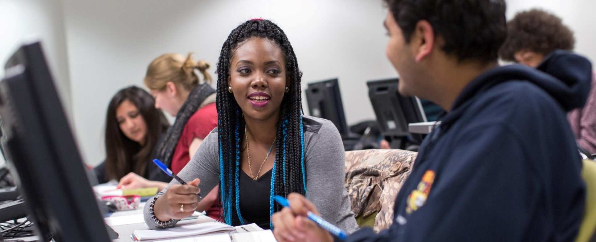 Students discussing work during a class