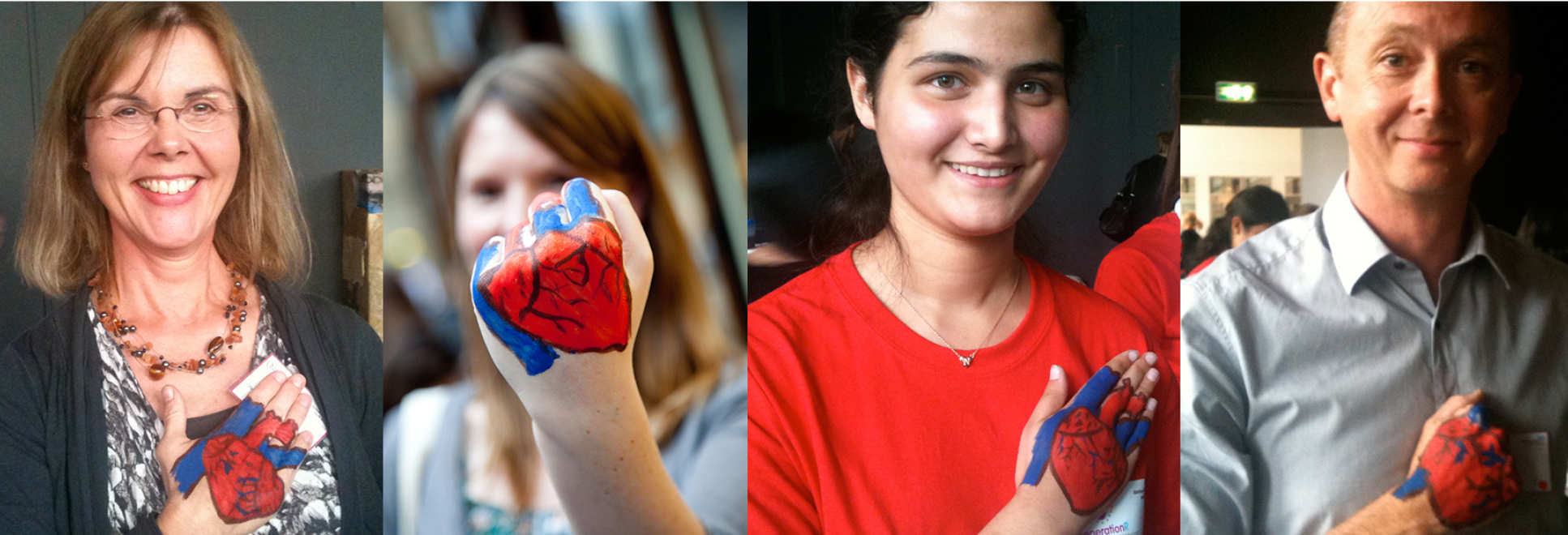 four people with hearts painted on hands