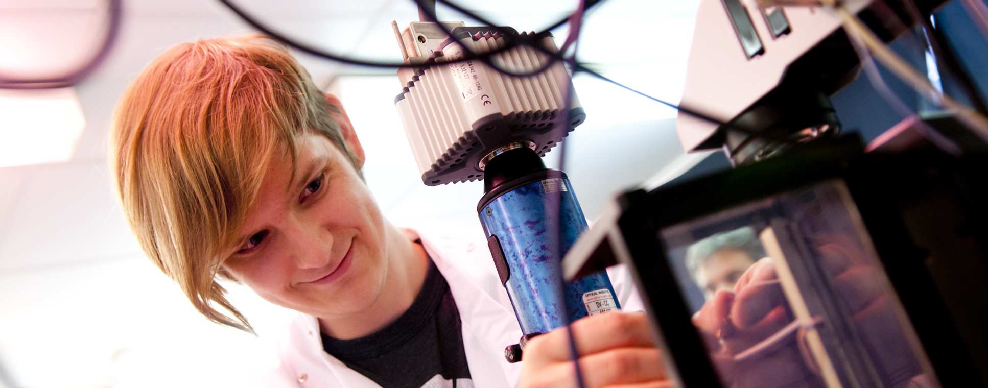 Man uses machine in lab