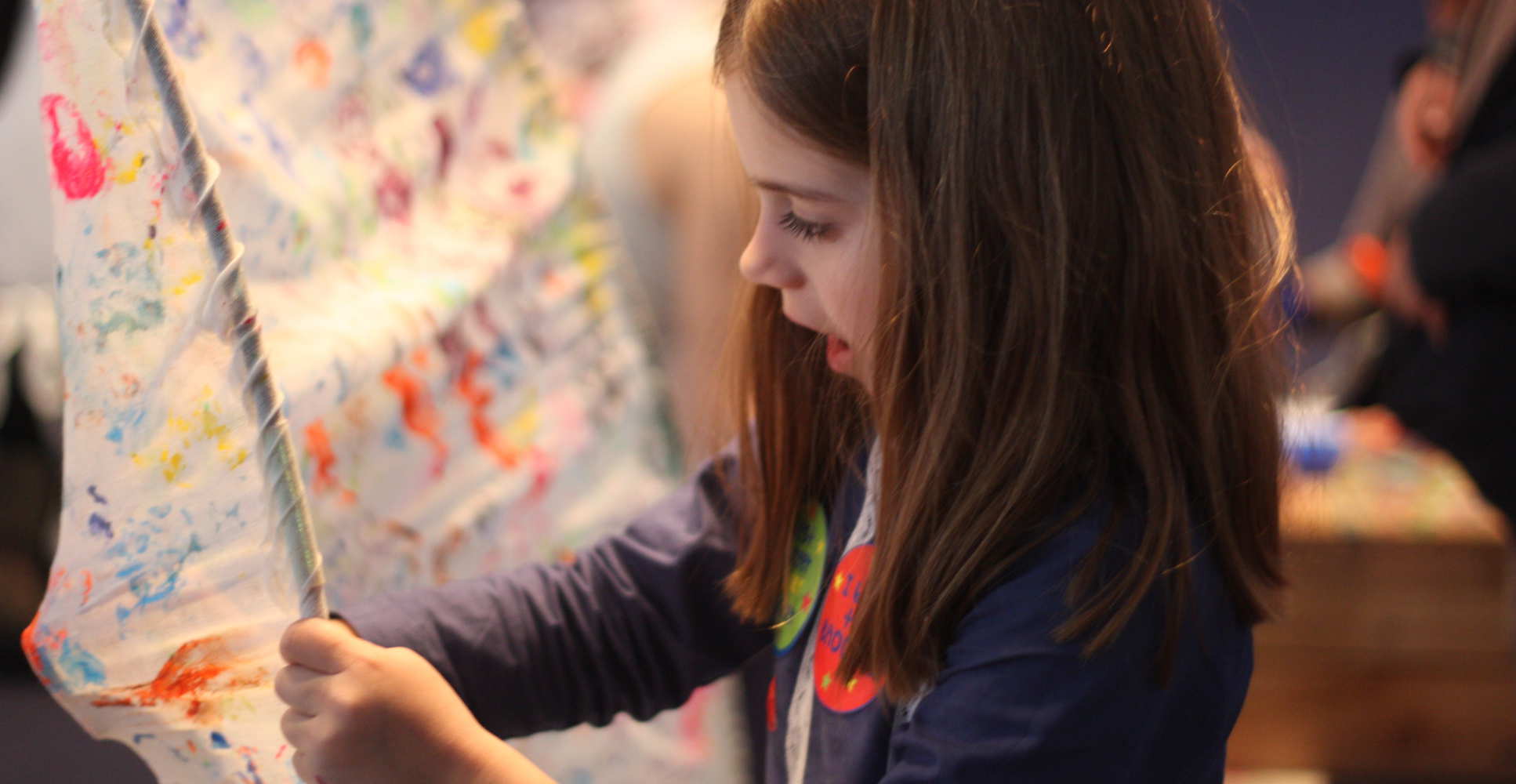 Girl interacts with exhibition