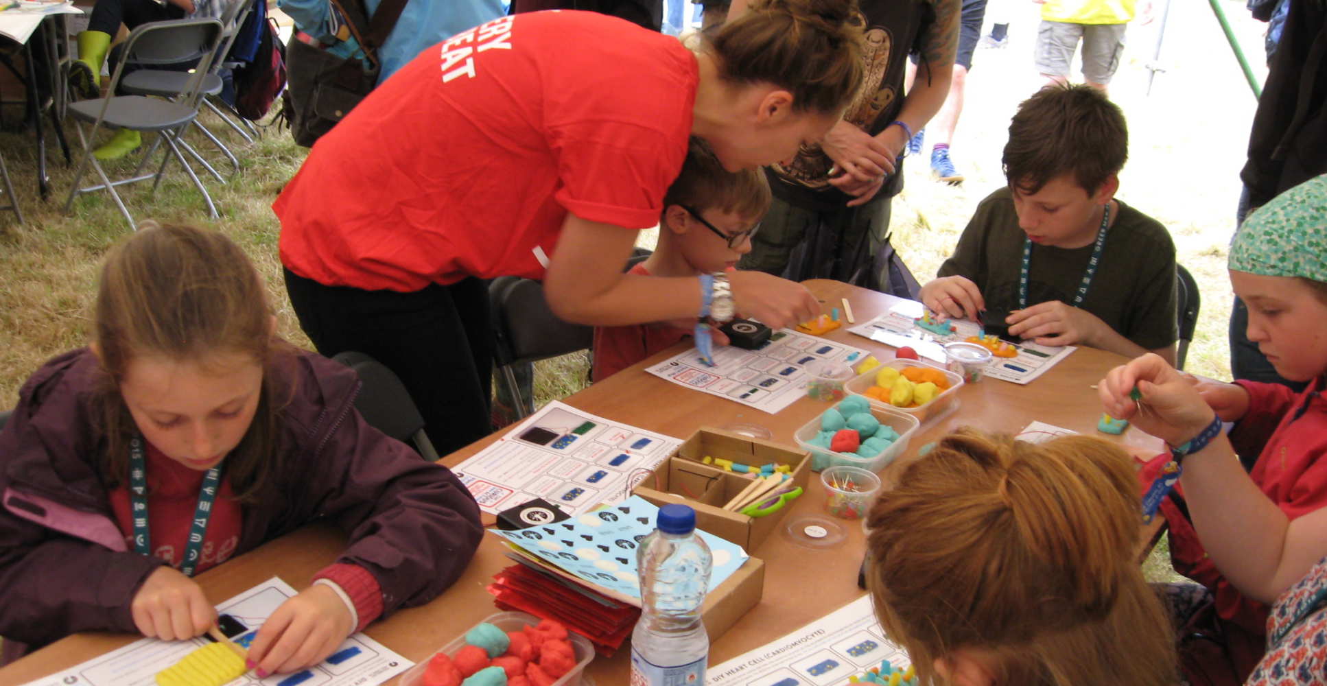 Scientist helps children with plasticine