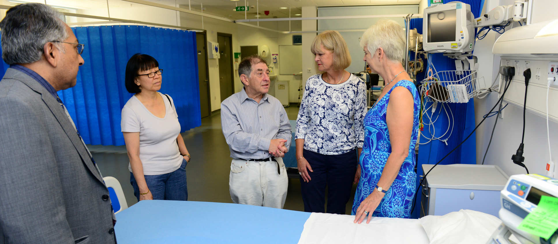 A doctor consulting with members of the public panel