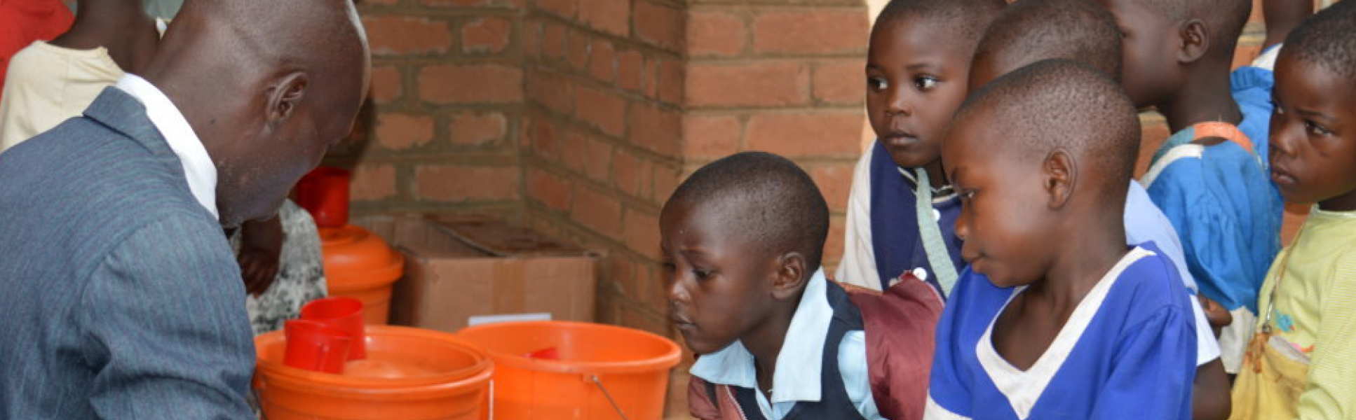 Children queueing for medicaiton