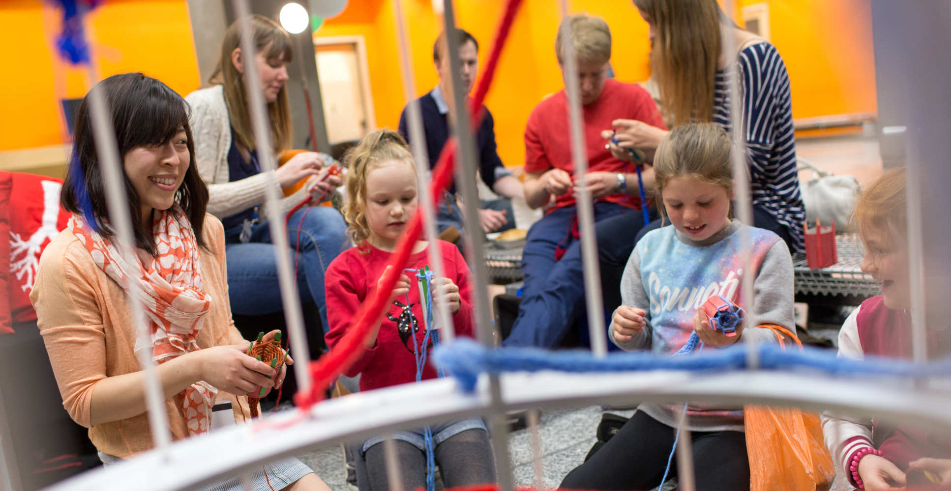 Scientist and children knit