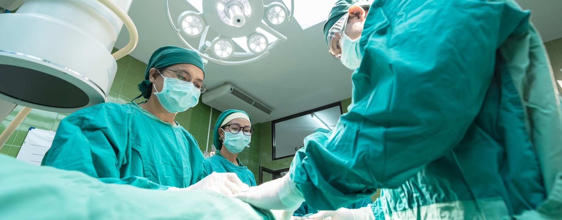 A group of surgeons performing an operation in a hospital