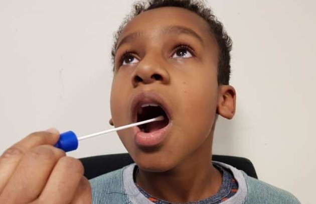 boy getting throat swab