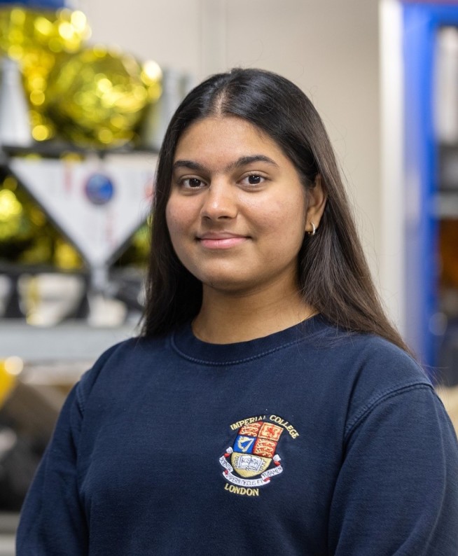 Student smiles at the camera