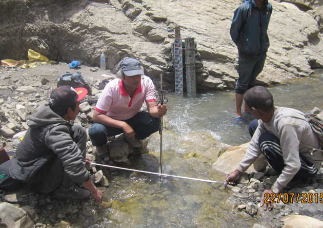 A man measuring water levels