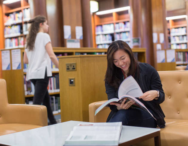 Student reading in the library