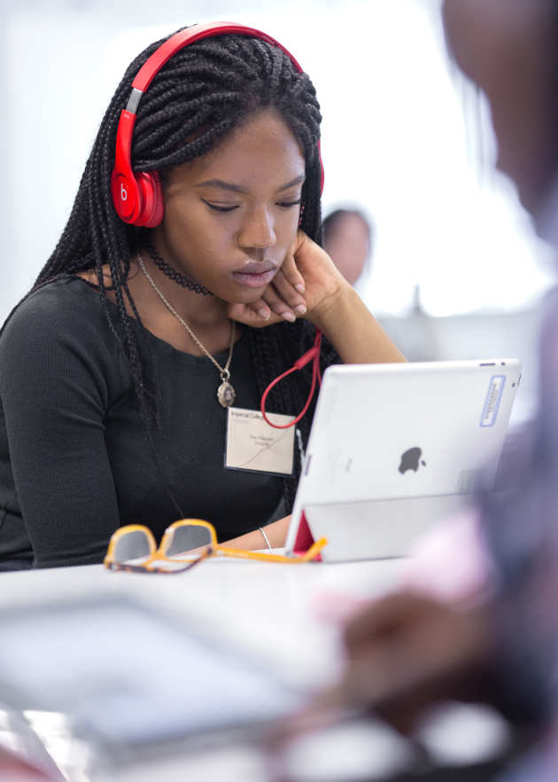 Student working with an iPad