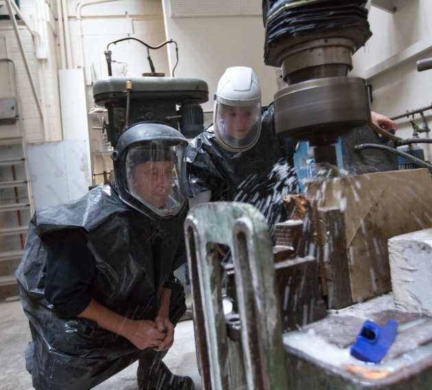 Student and staff using equipment