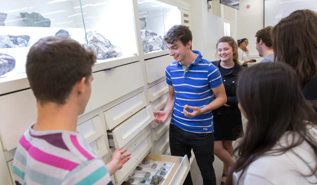 Students looking at rocks together