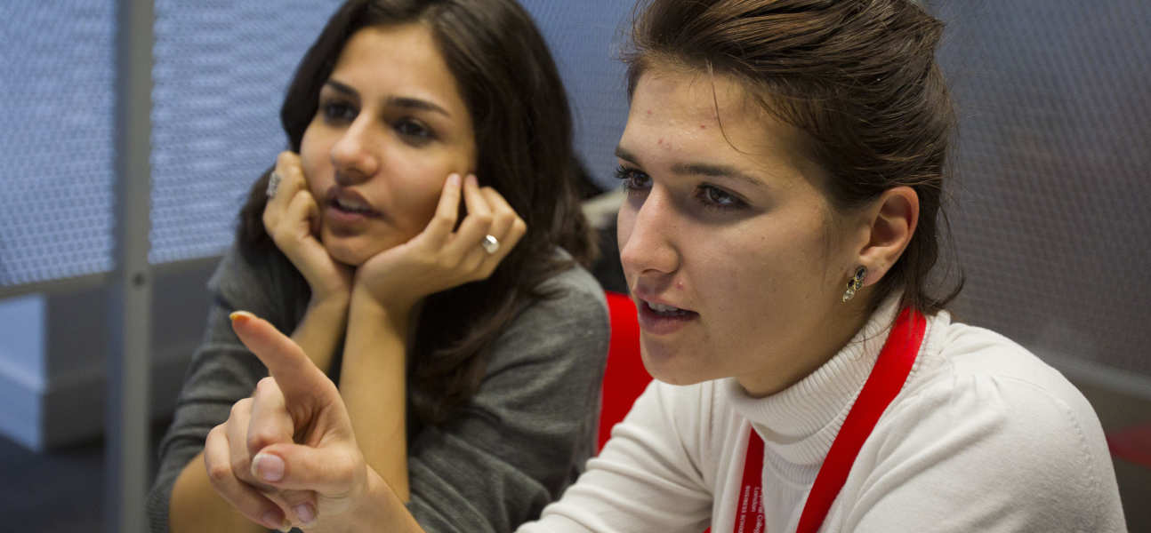 Two students discussing together