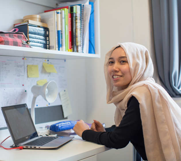 Student on her laptop in halls