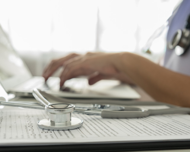 Health worker using a laptop