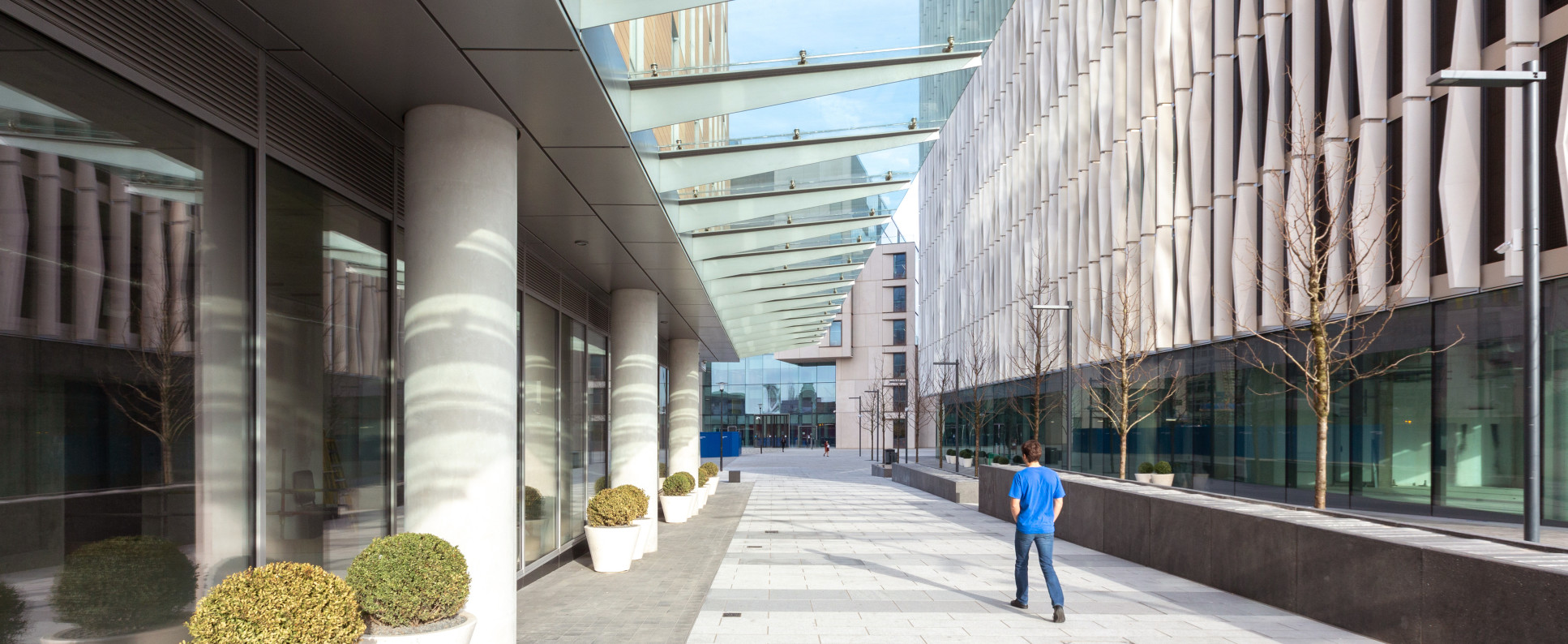 Man walking outside Uren Building