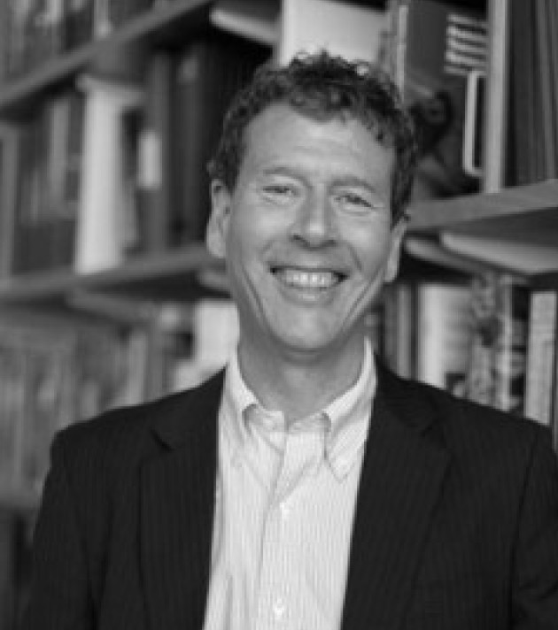 Black and white head shot of man smiling