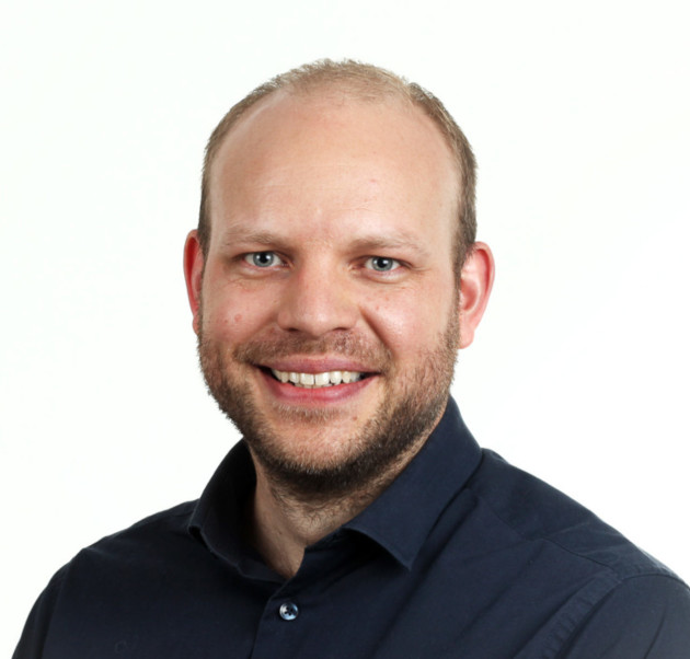 Black and white headshot of man