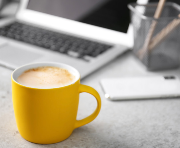 laptop and yellow cup