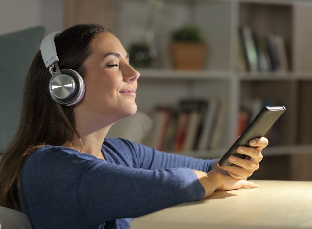 woman listening to podcast